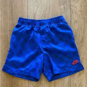 Nike Kids Blue Athletic Shorts with Orange Swoosh
